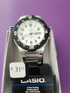 Casio Silver Watch with White Dial and Black Bezel